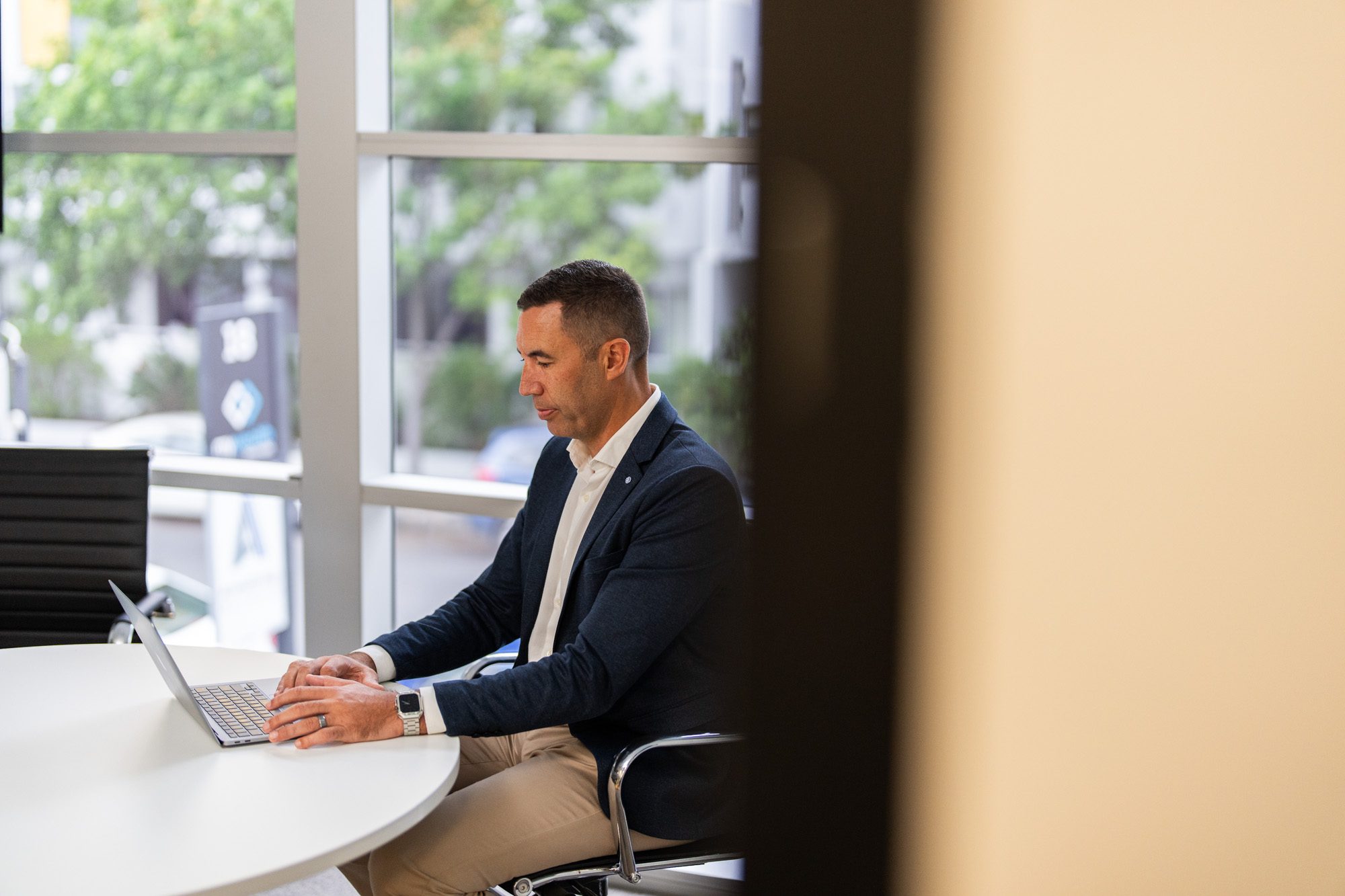 man on his laptop working in a meeting room